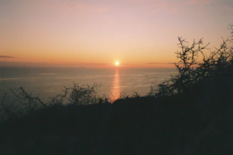 A captivating frame featuring a sunset over a calm ocean horizon.