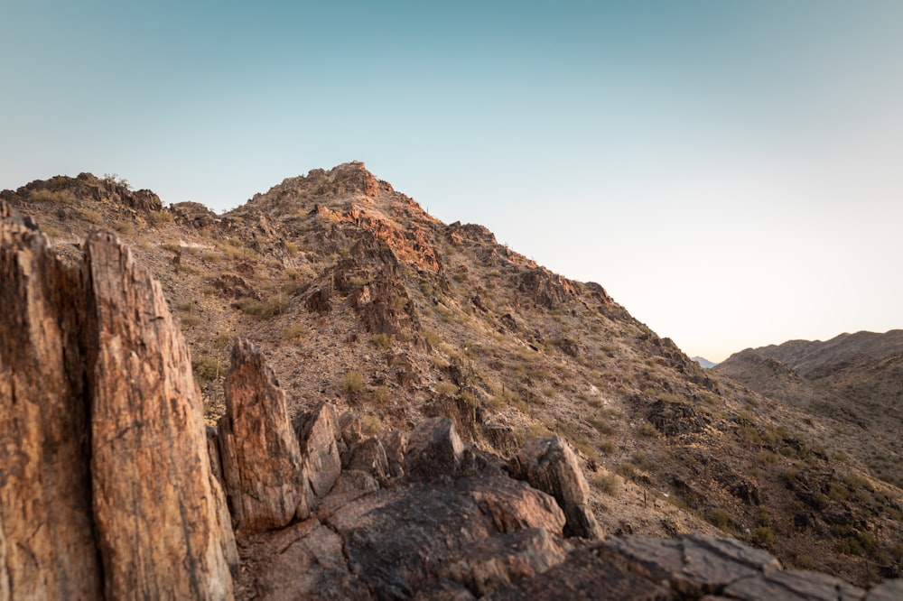 brown rocky mountain under blue sky during daytime