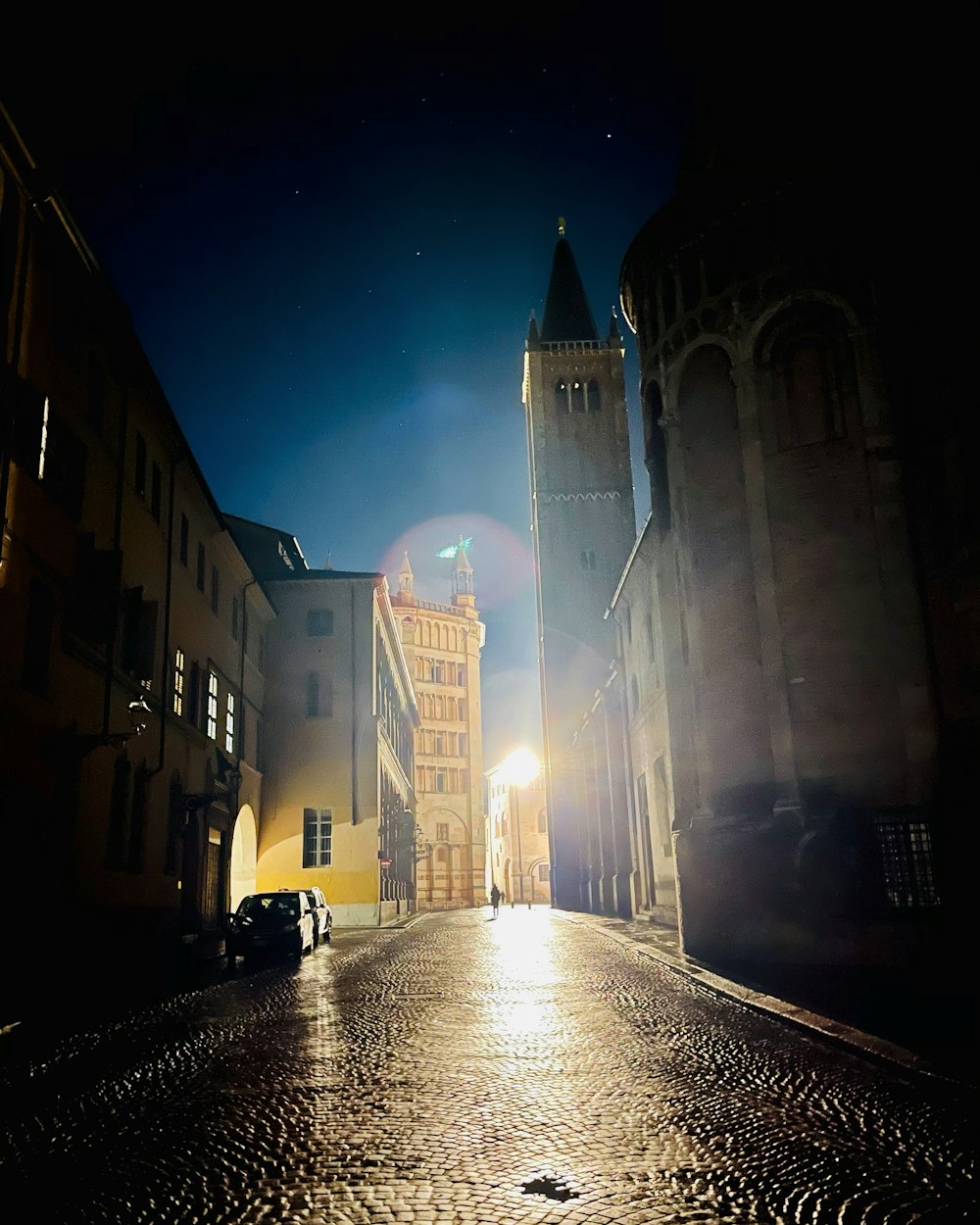 people walking on street near buildings during night time