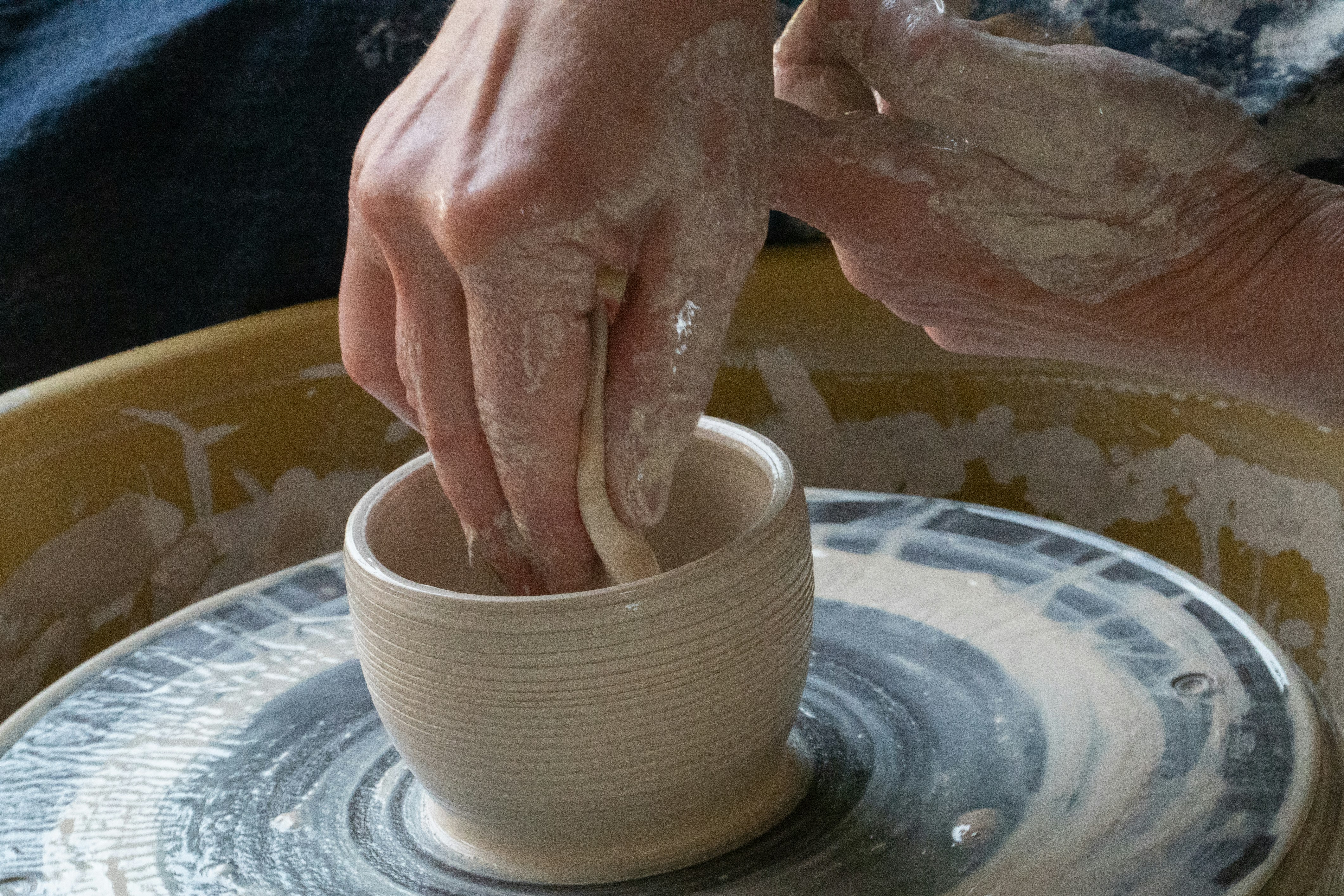 person holding white ceramic round bowl