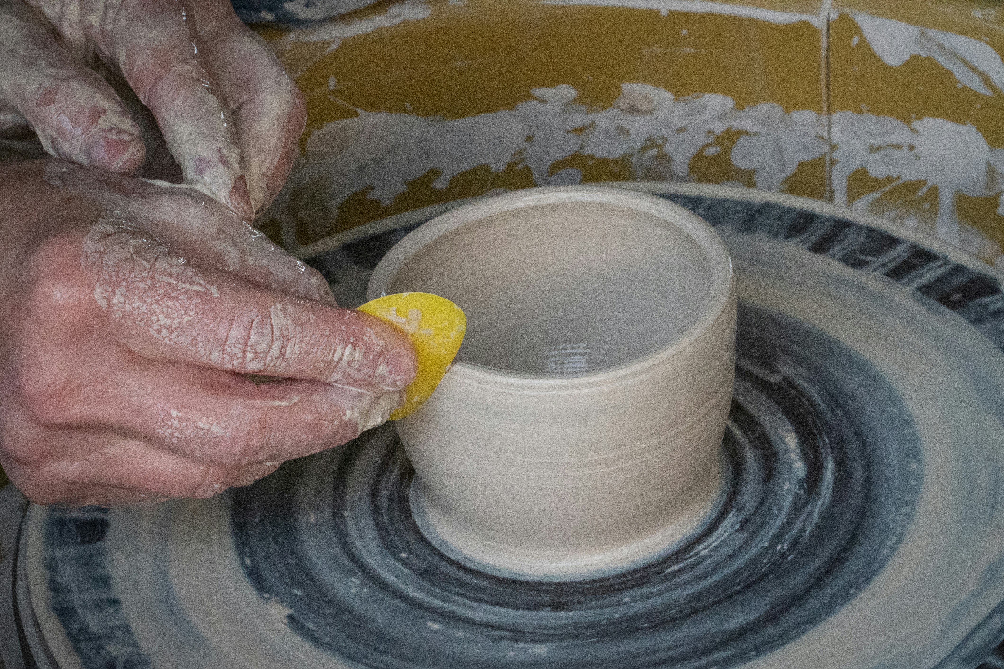 person holding white round ceramic bowl