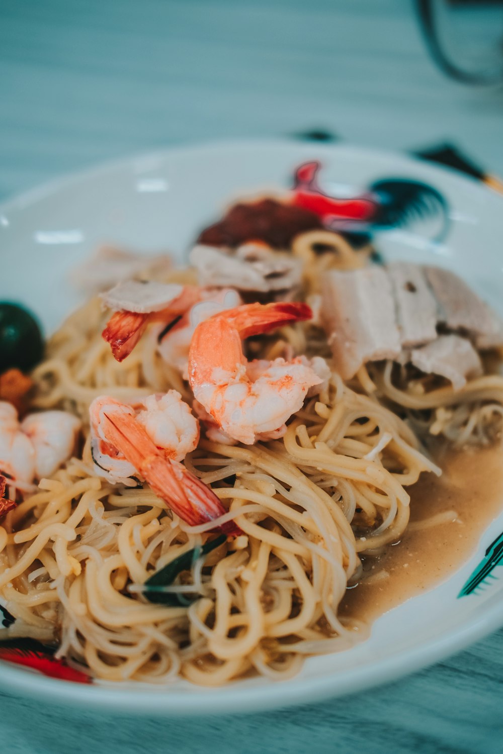 pasta with shrimp on white ceramic plate