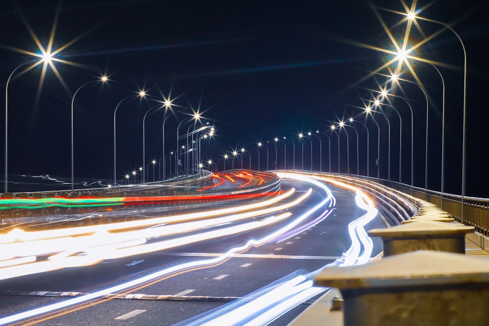 time lapse photography of cars on road during night time