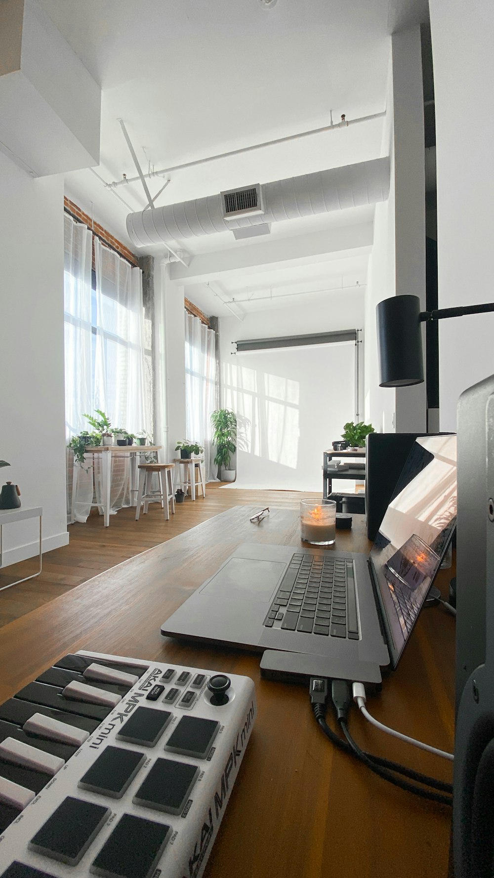 black and silver laptop computer on brown wooden table