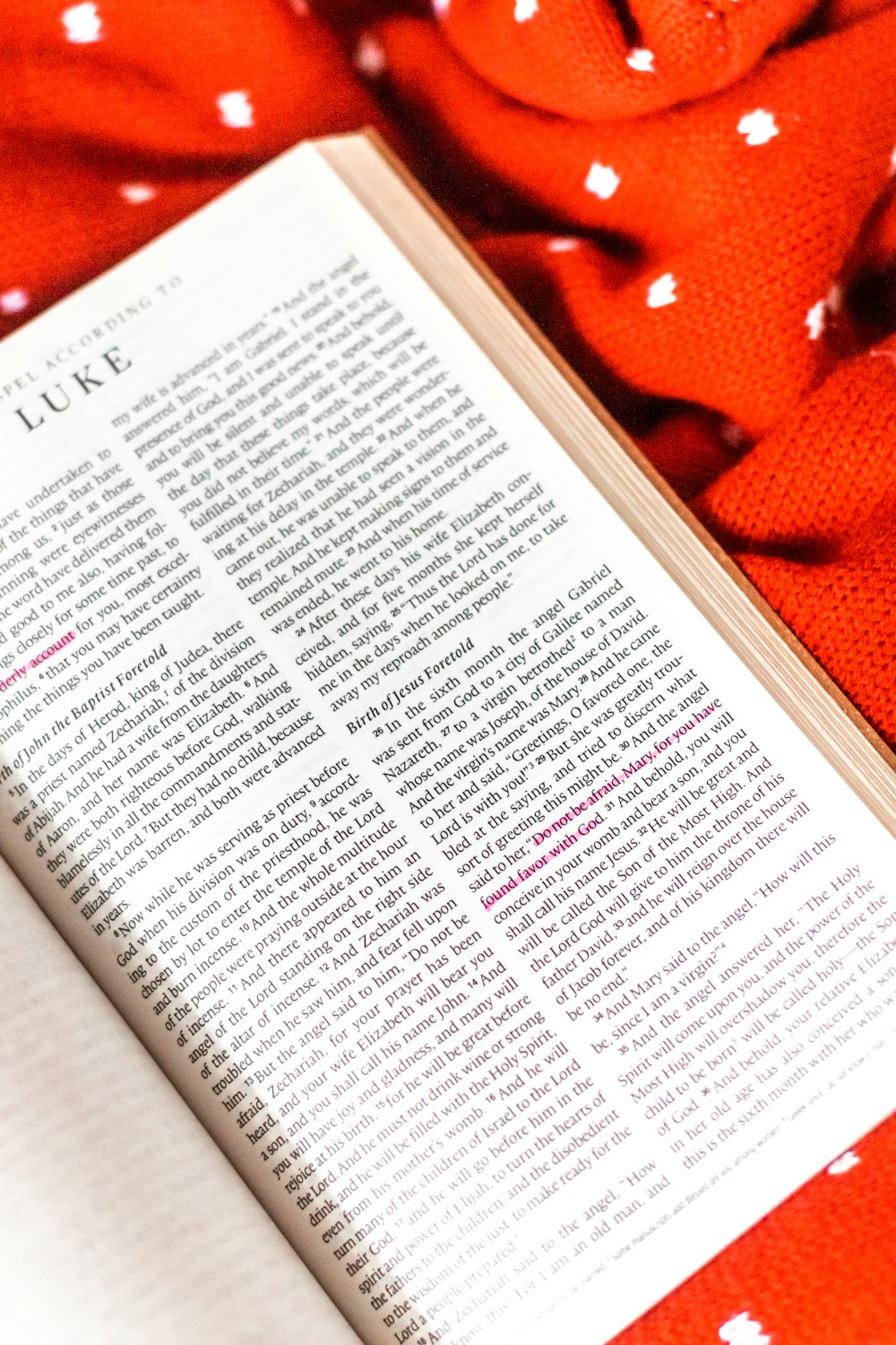 white book page on orange textile