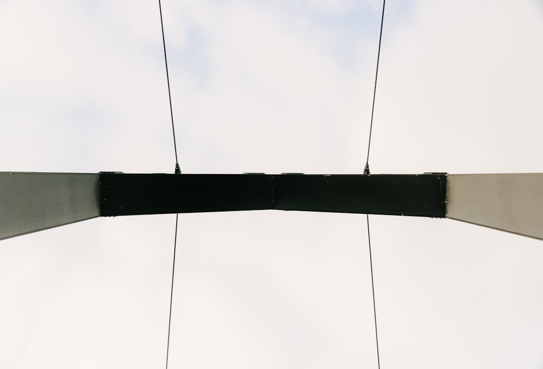 black electric wires under white clouds