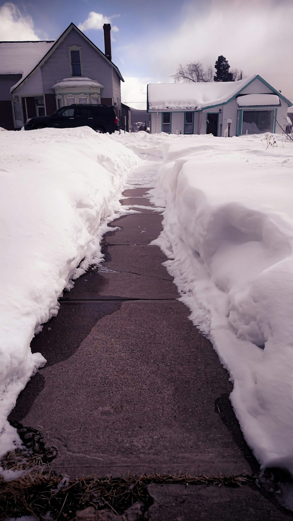 snow covered road during daytime