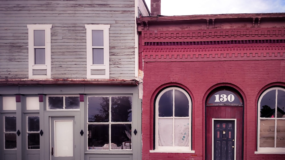 red brick building with white wooden window