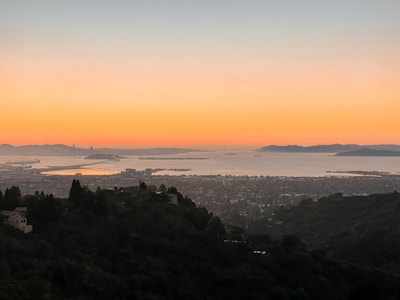 A scenic view of the coastline at sunset.