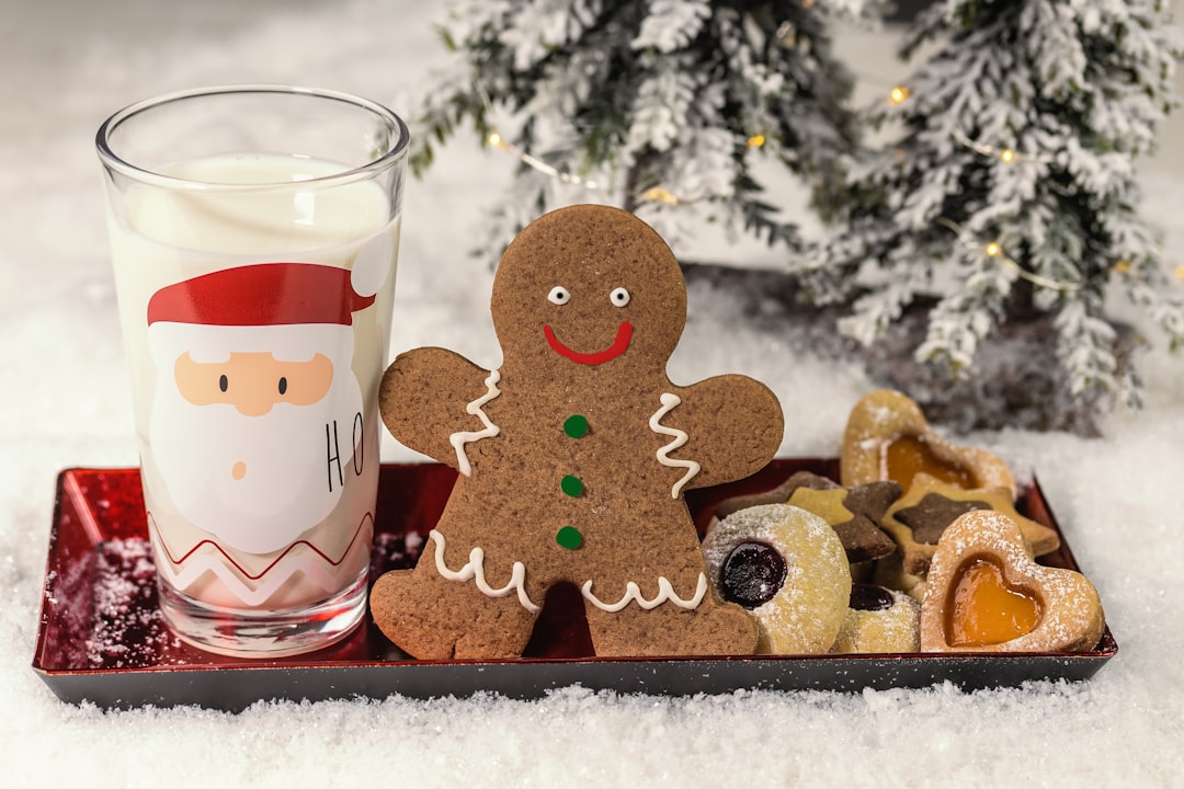 brown bear figurine beside clear drinking glass, gingerbread man with nicolausteller in winter atmosphere
