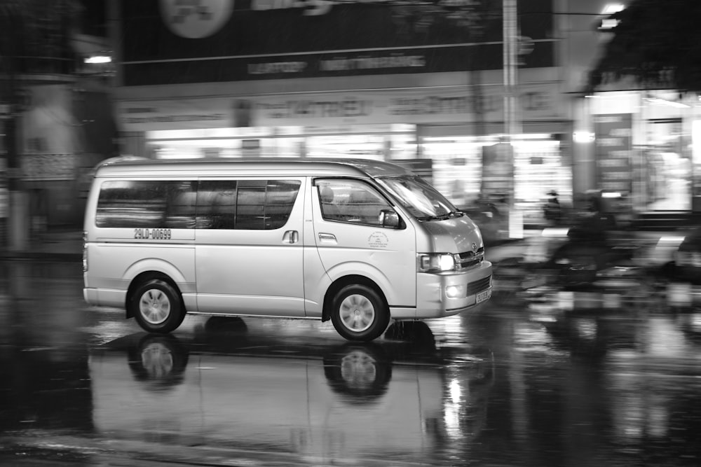 white van in grayscale photography