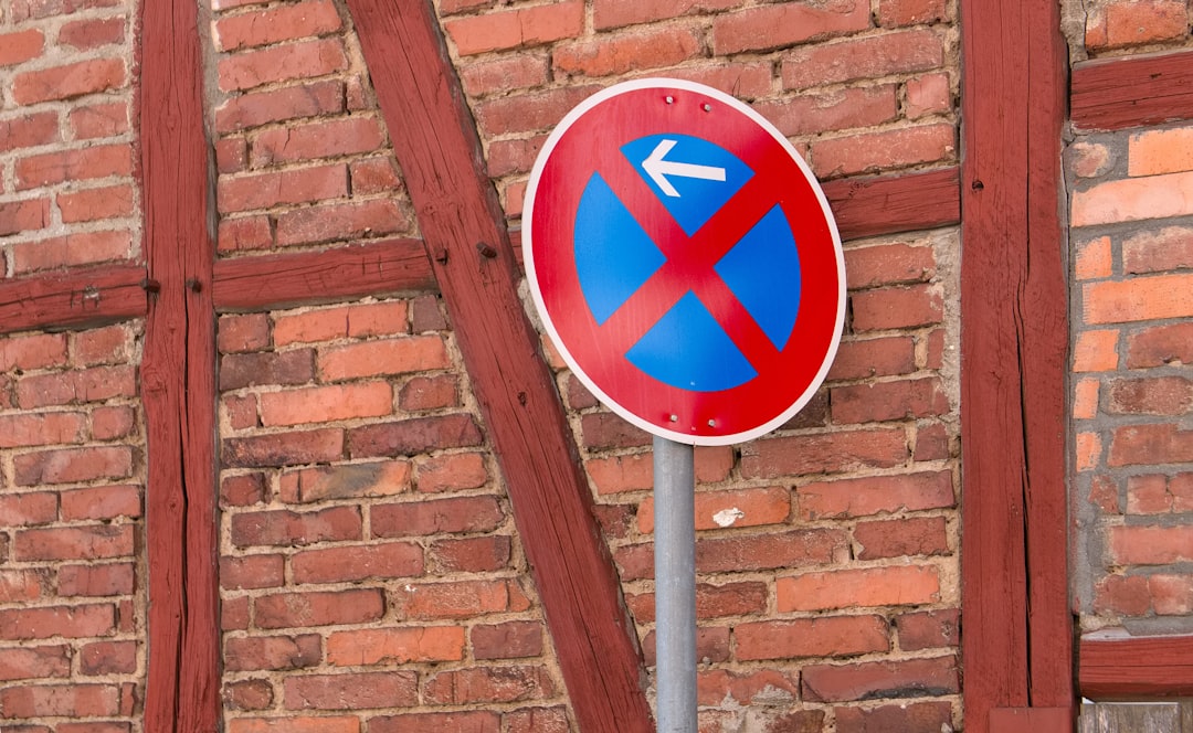 blue and white arrow sign