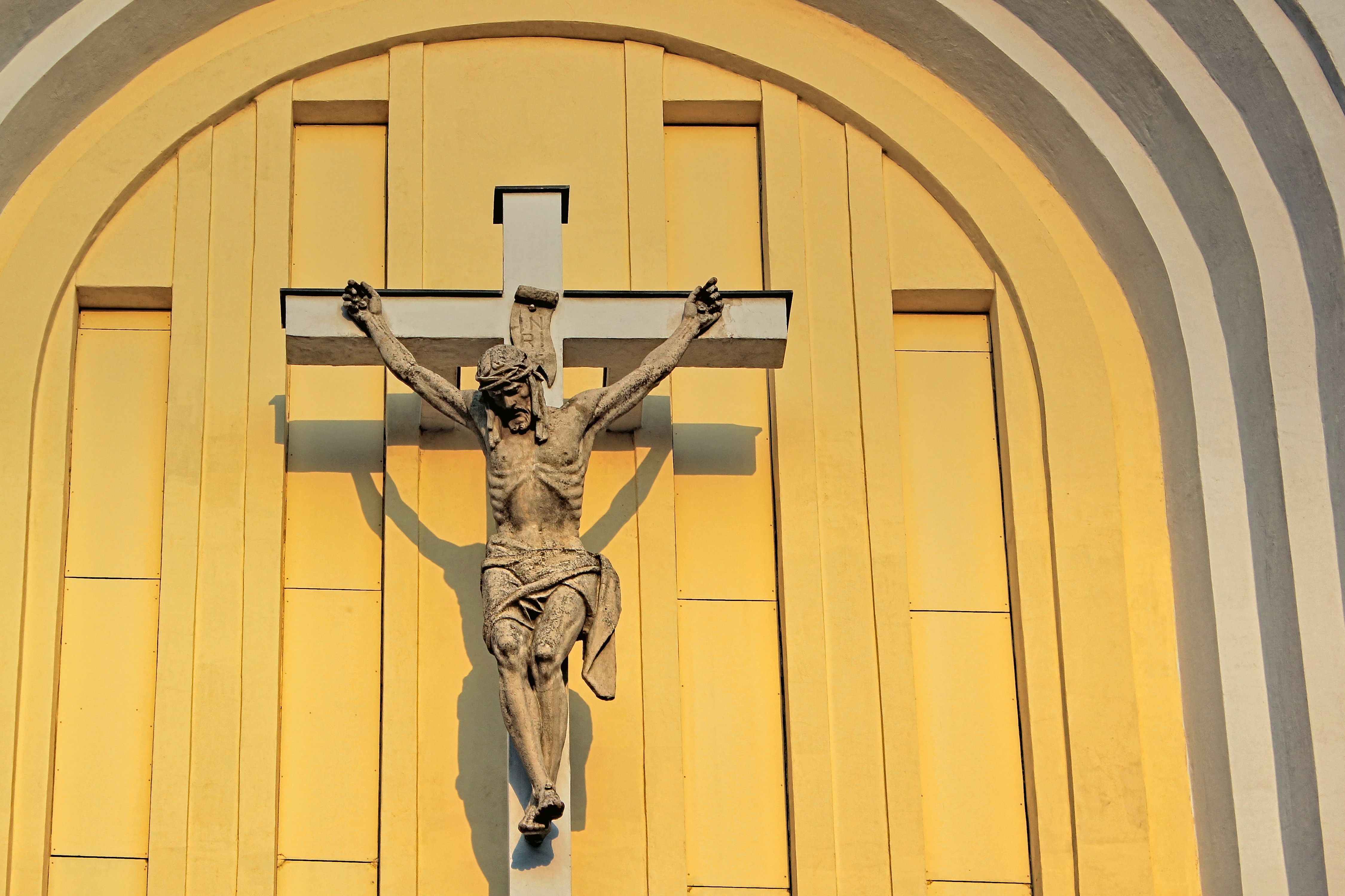 man in white pants and shoes statue