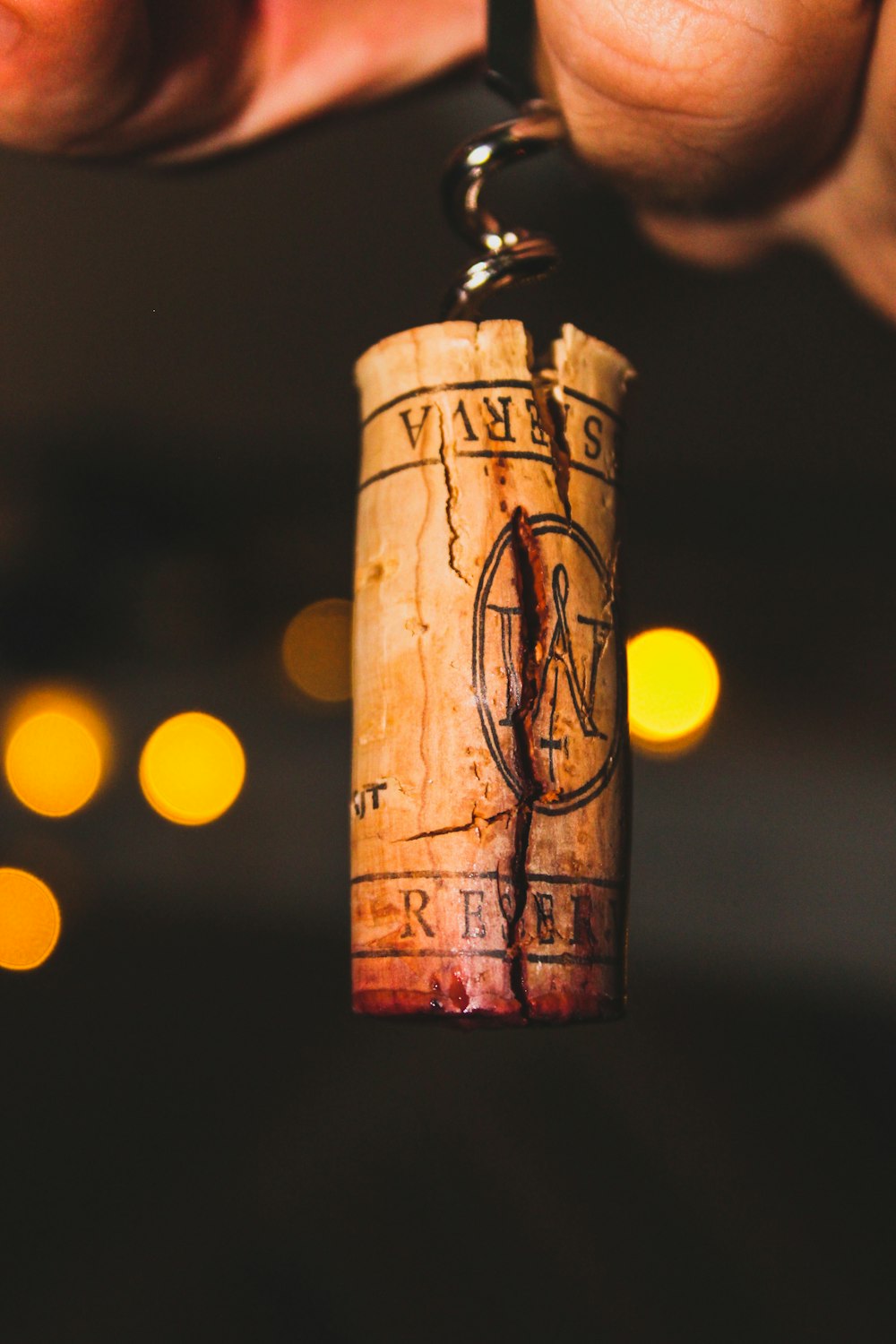 brown wooden cross with yellow light bokeh