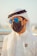 man in white button up shirt wearing black sunglasses and brown hat