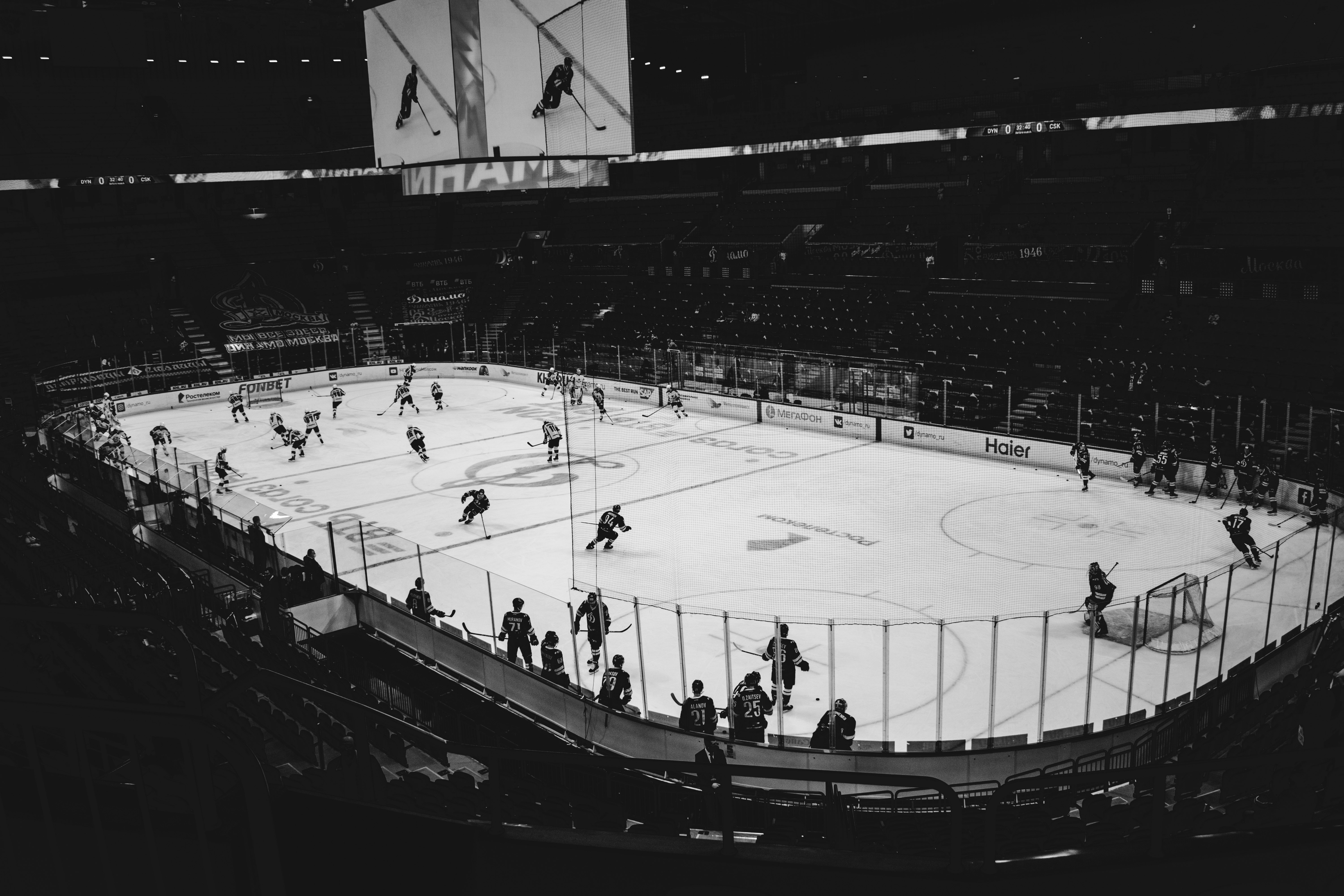 people playing ice hockey on stadium