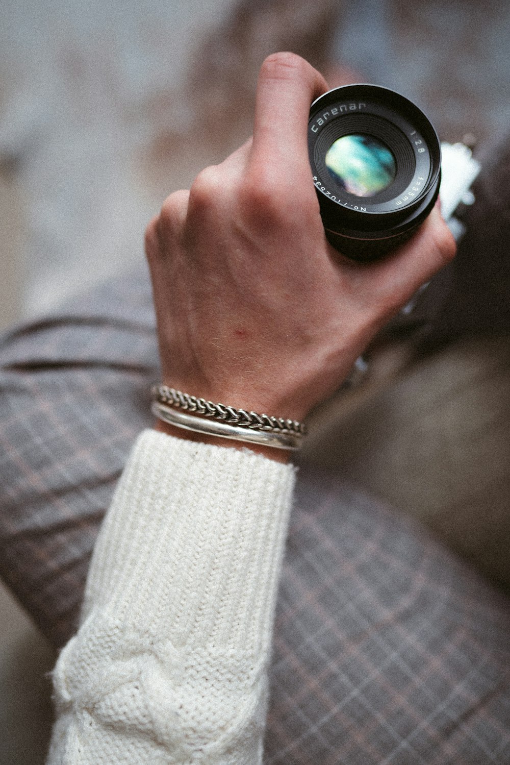 person wearing gold and silver bracelet