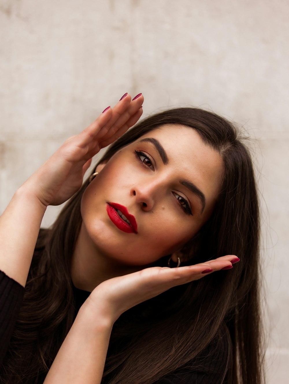 woman in black long sleeve shirt with red lipstick