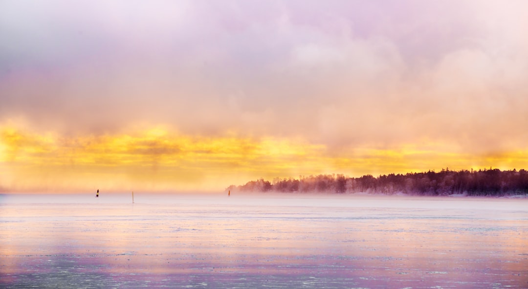 body of water during sunset