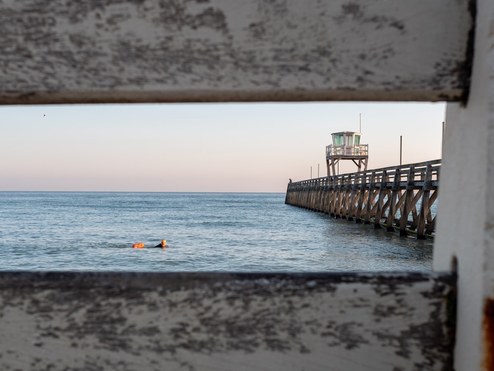 brown wooden dock on sea during daytime