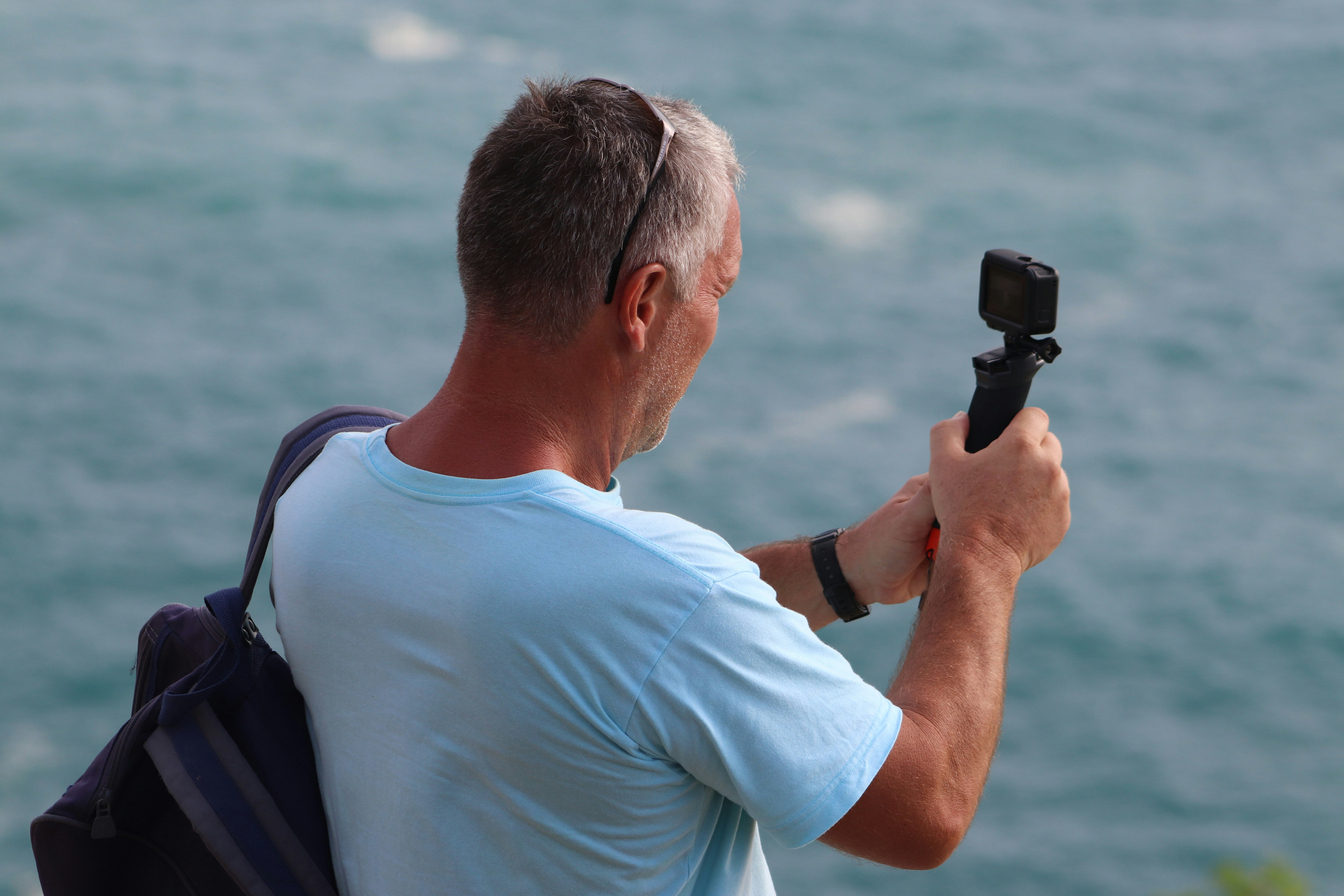 Tourists using binoculars on a whale watch tour in Maui