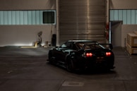 black porsche 911 parked in garage