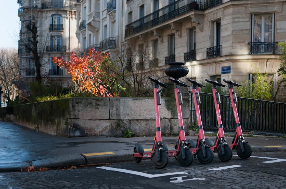 red kick scooter on road during daytime