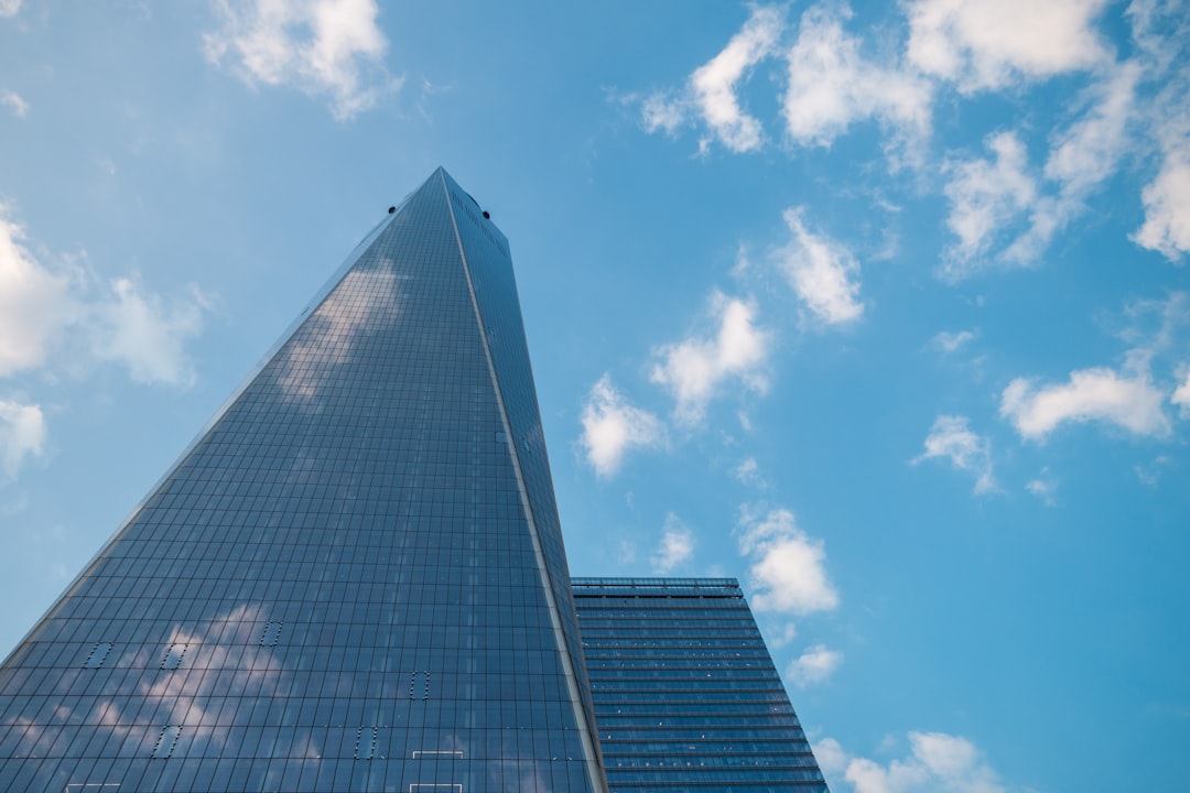 low angle photography of high rise building under blue sky during daytime