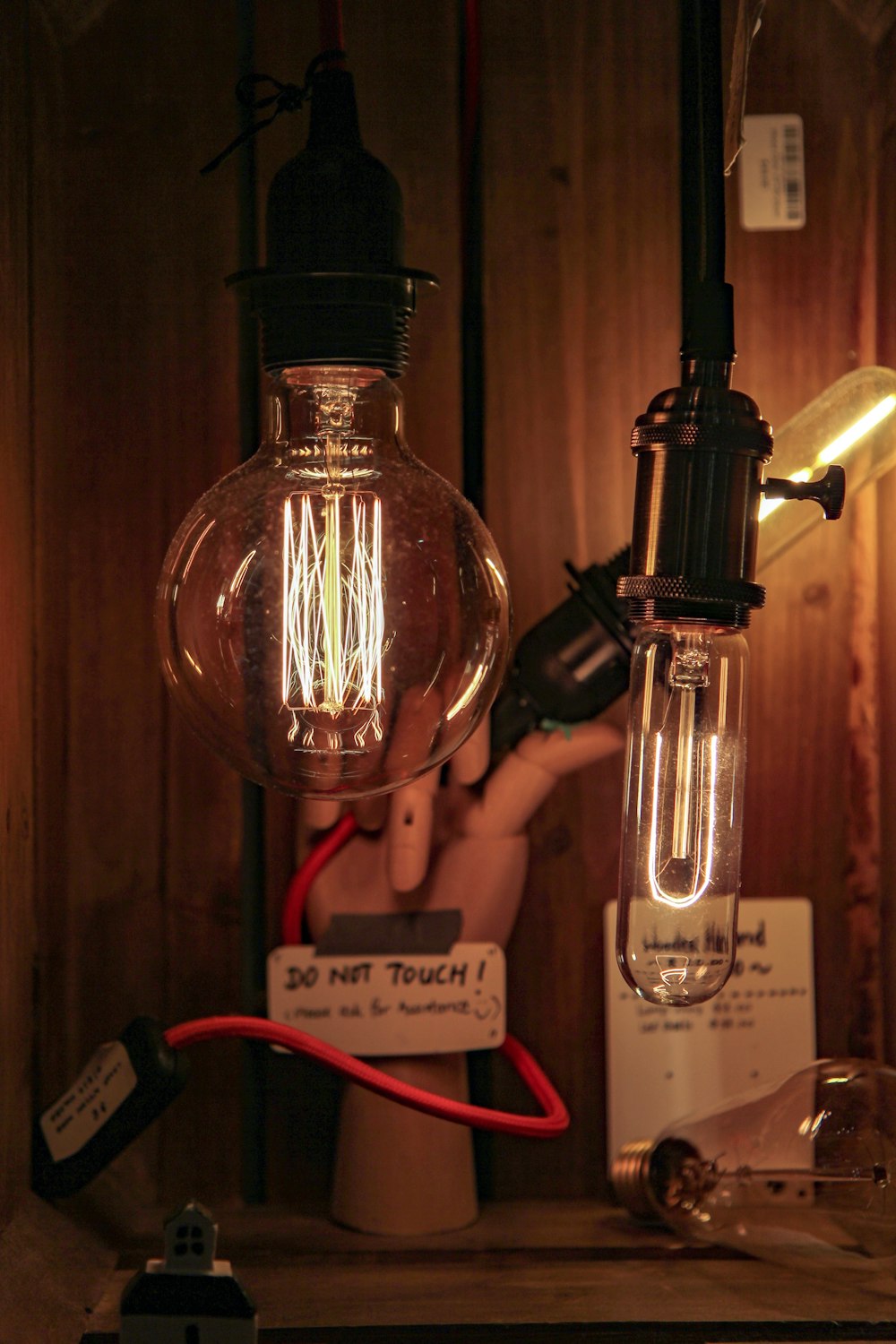 clear glass bottle with red strap