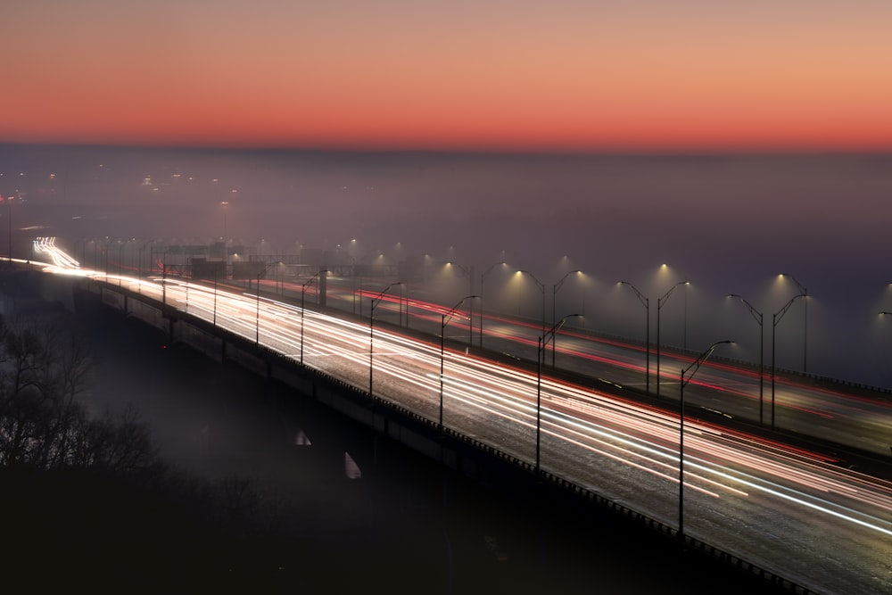 white and black bridge during sunset