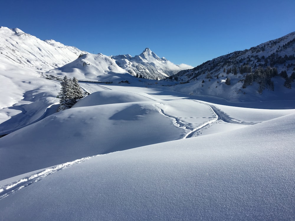 snow covered mountain under blue sky during daytime