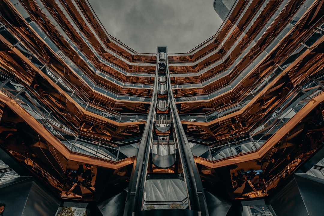 low angle photography of brown and gray concrete building