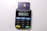 A small electronic card reader, featuring a keypad with numbers and function buttons. A card is inserted into the top slot, exposing its chip and indicating contactless functionality. The device has branded labels and a display screen.