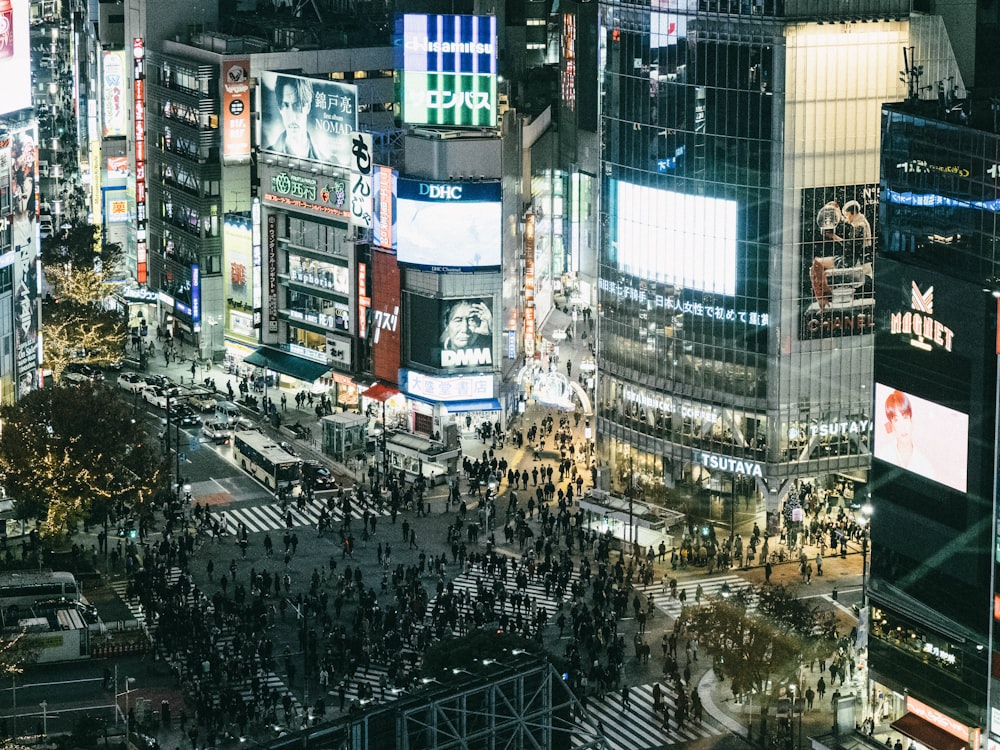 people walking on street during night time