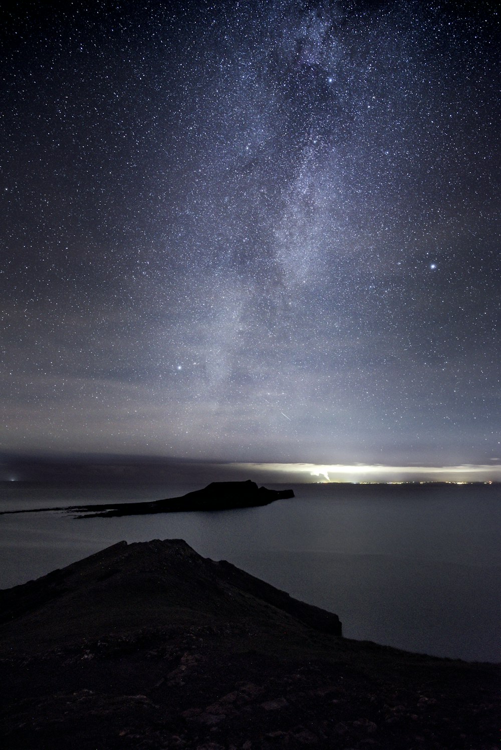 black mountain under starry night