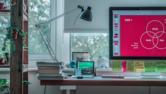 black desk lamp on white wooden desk