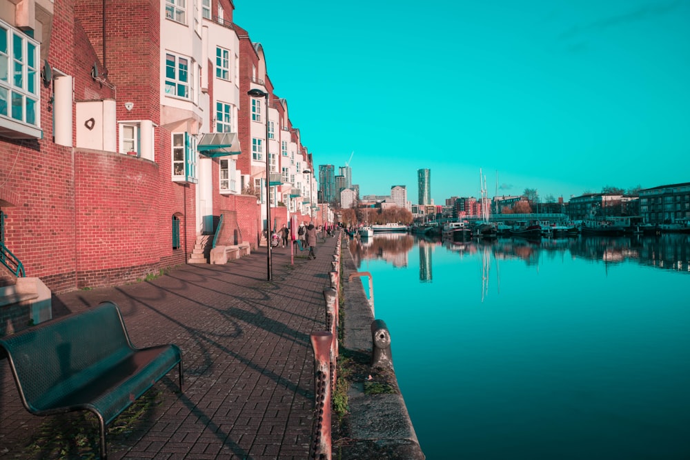 brown concrete building beside body of water during daytime