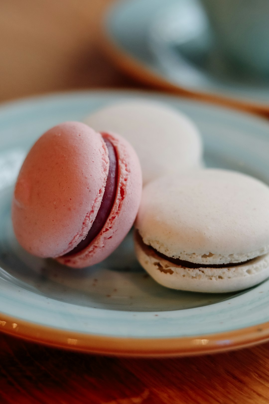 white and pink ice cream on white ceramic plate