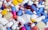 white blue and orange medication pill