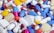 white blue and orange medication pill