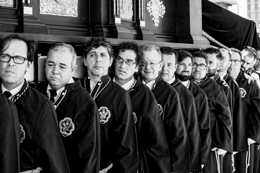 group of men in black robe