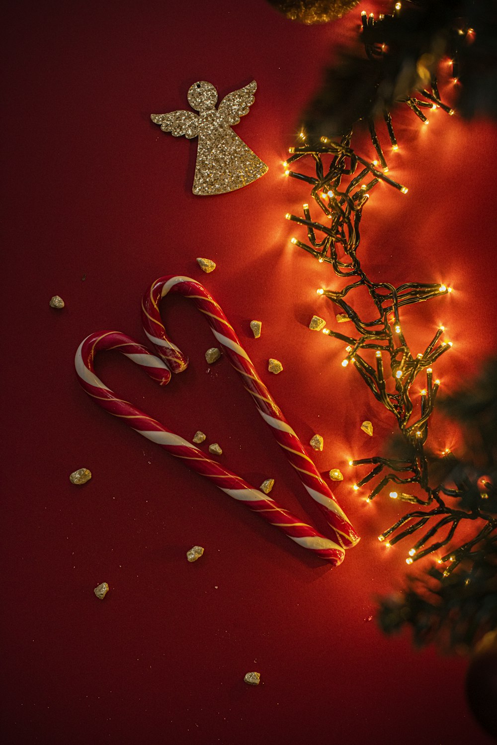 red and white candy cane on red and white christmas tree