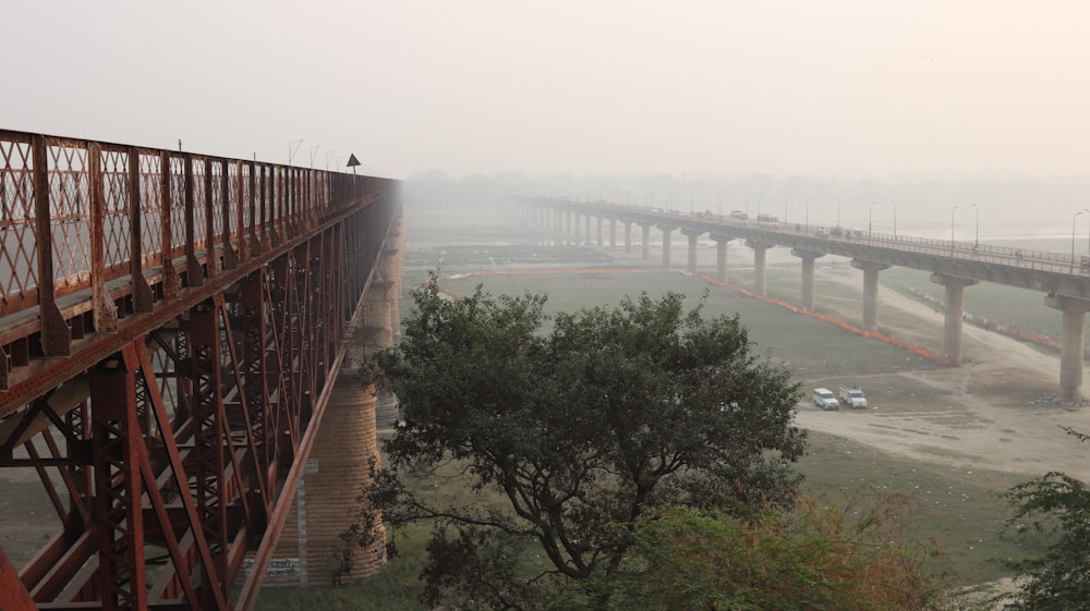 brown bridge over body of water during daytime