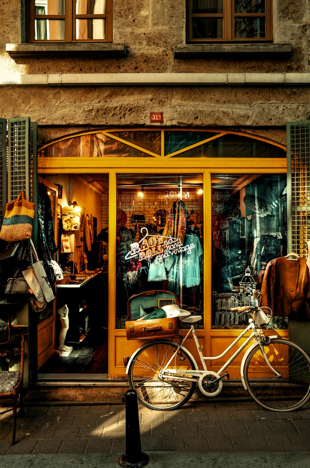 brown city bike beside brown wooden door