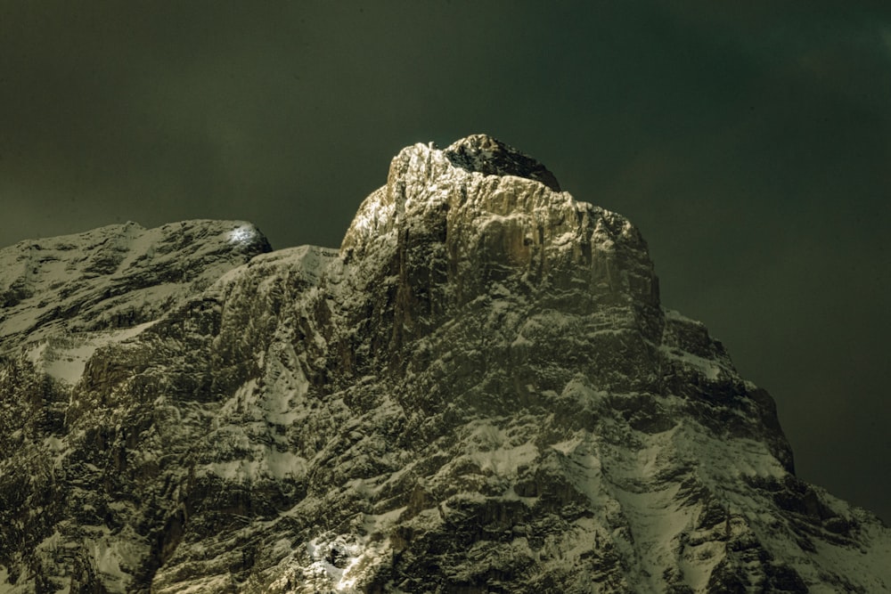 gray rocky mountain under gray sky