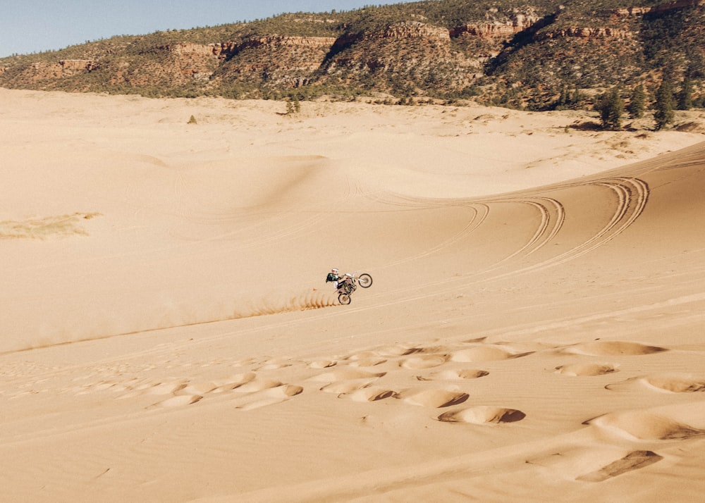 people walking on sand during daytime