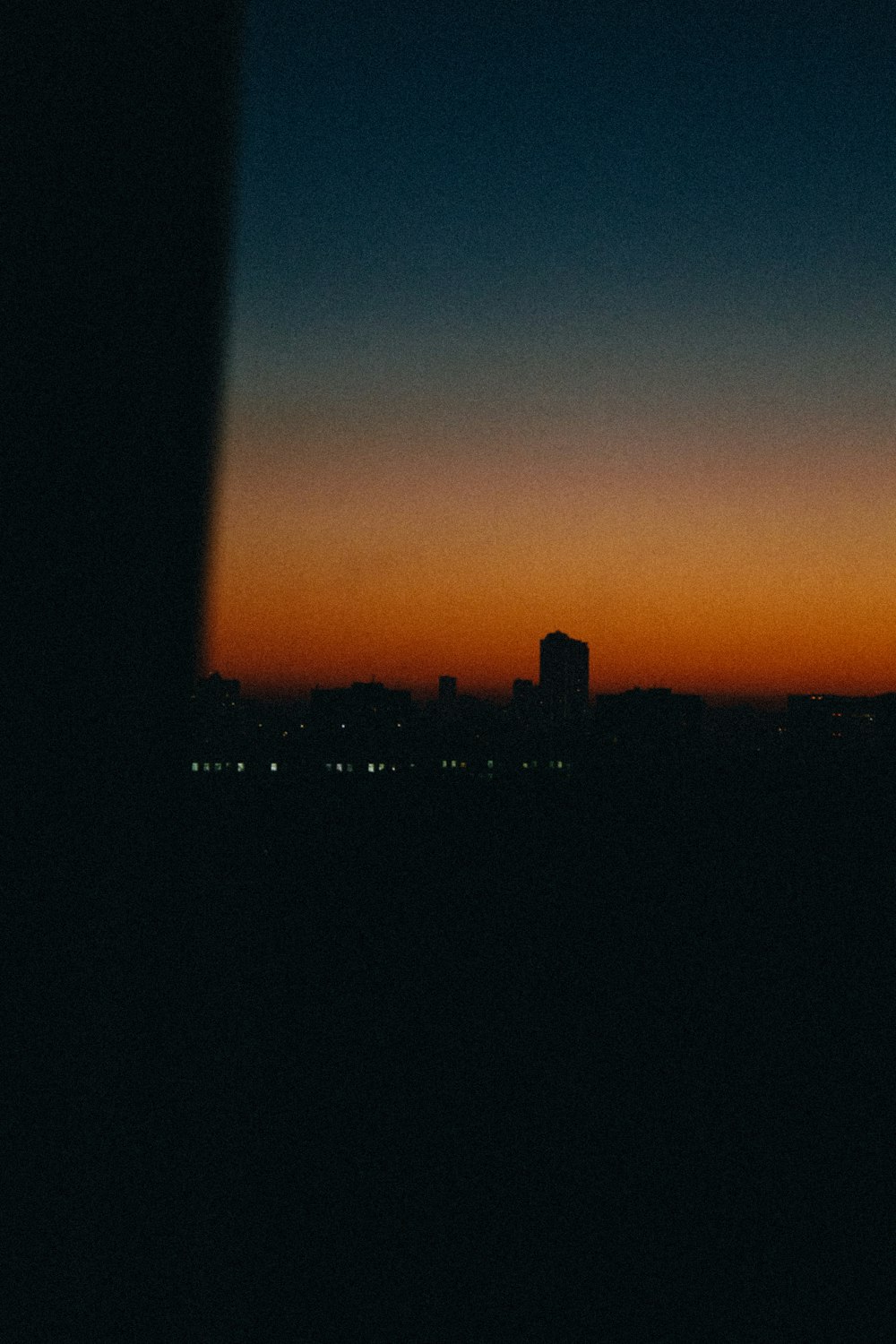 silhouette of city buildings during sunset