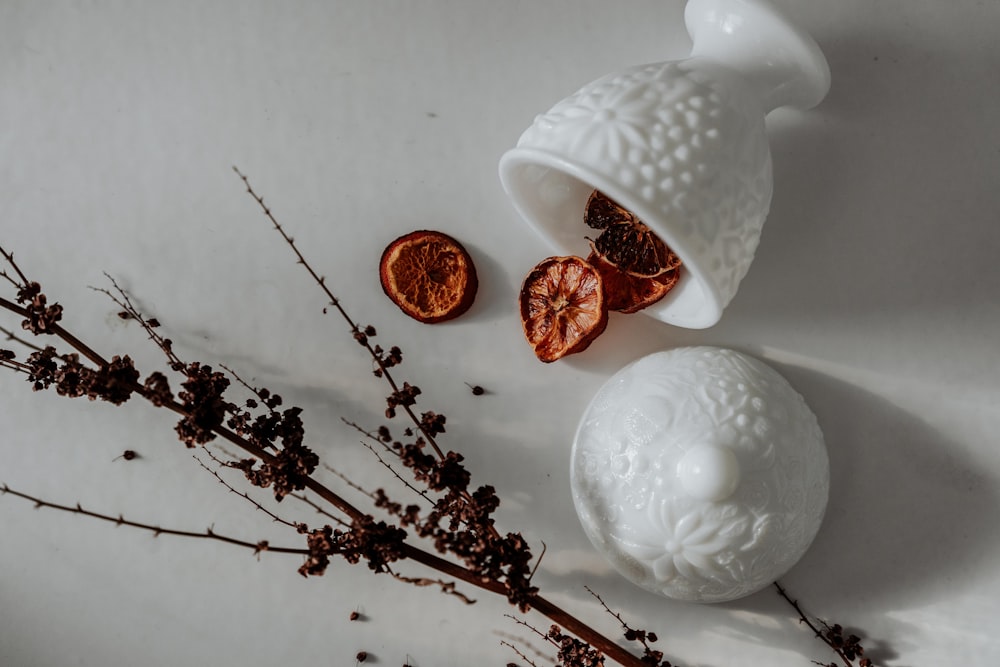 white ceramic vase on white surface