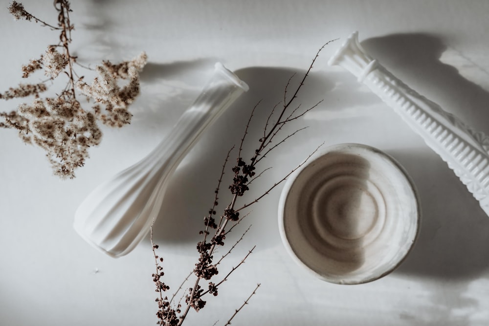 white ceramic cup on white ceramic saucer