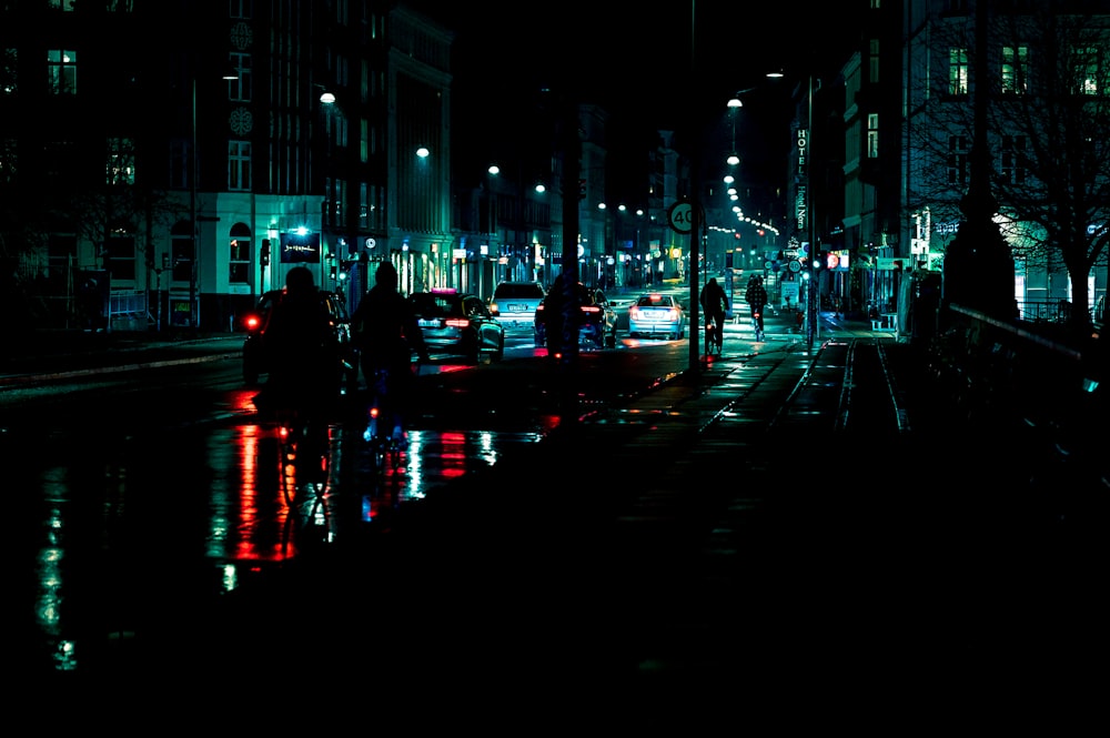 black concrete road with cars during night time